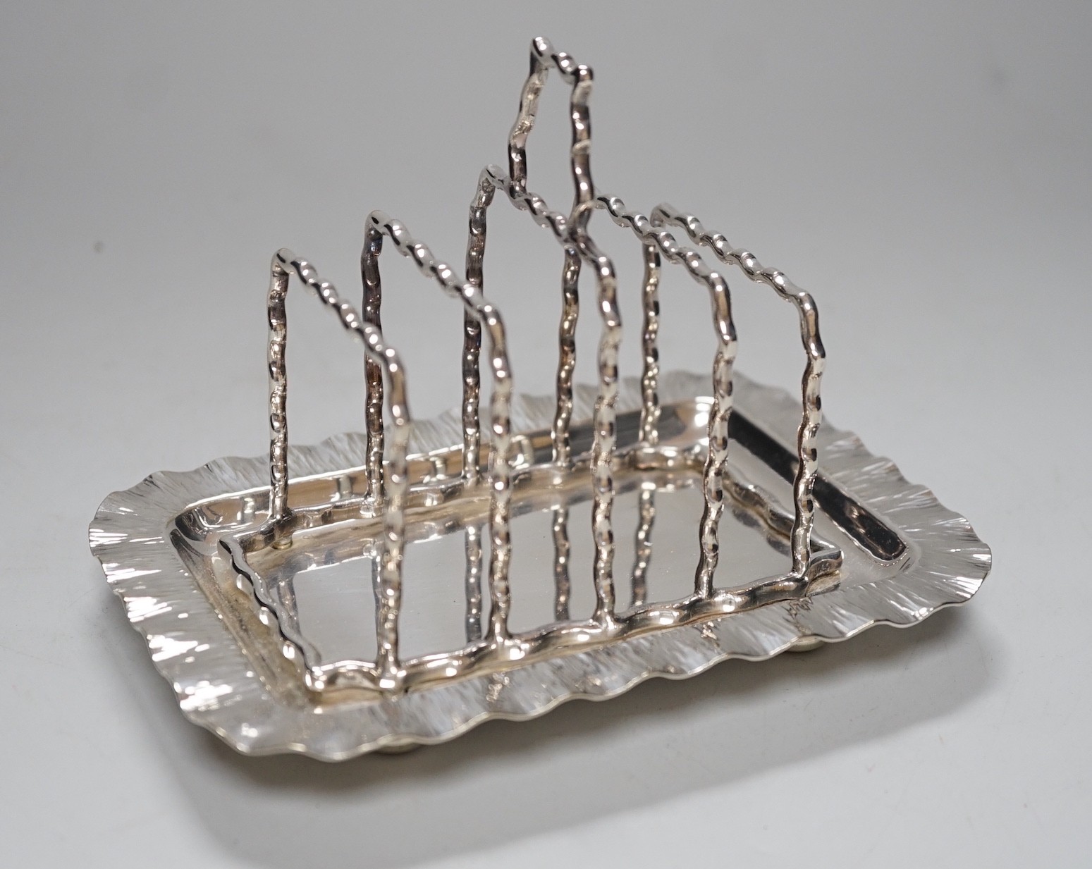 A Hukin & Heath silver plated toast rack, 16cm long